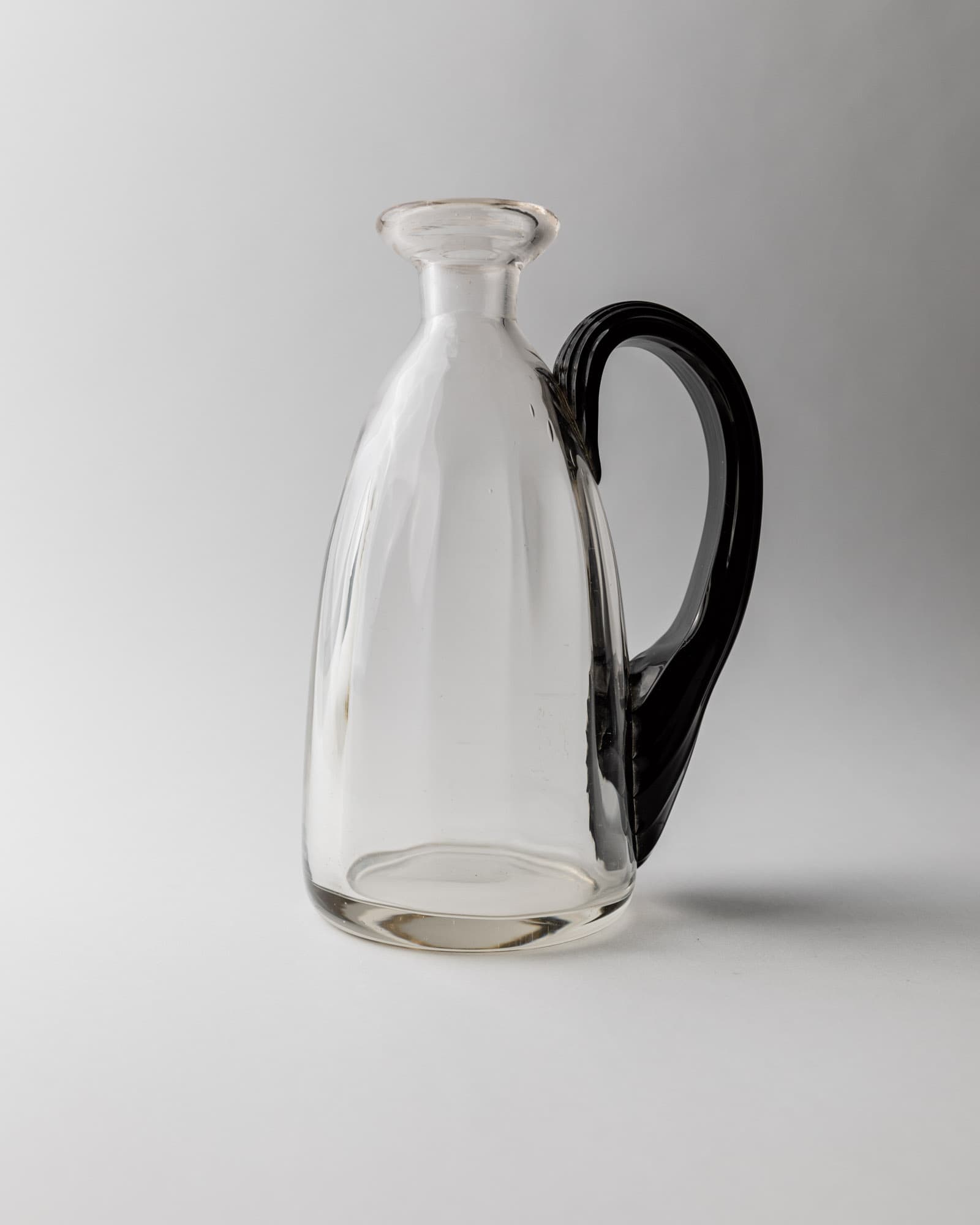 Vintage 1930s Murano Glass Vase or Pitcher, Clear Glass with Curved Structured Handle, Elegant Italian Design Object, Table Decor, Timeless Gift Idea_Bottega Jacobs