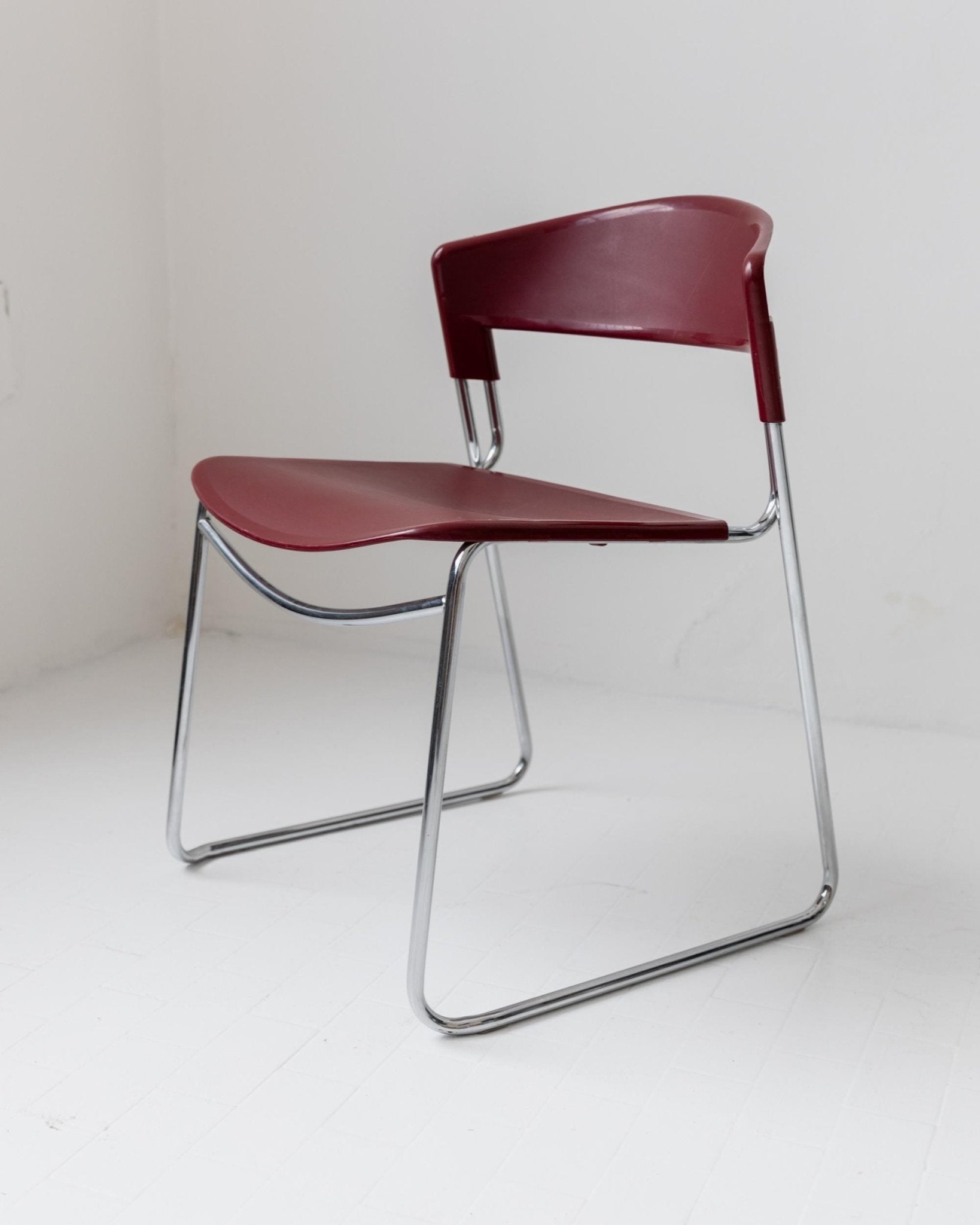 Vintage 1980s Dining chair by Paolo Favaretto for Assisa, stckable Design Italy 1986 - chrome and plastic in red - design classic_Bottega Jacobs