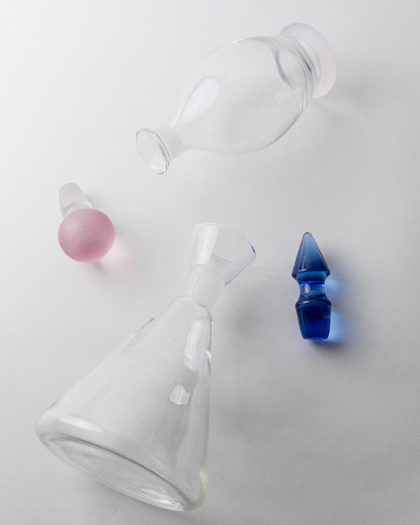 Vintage 1980s Glass Decanter Set of 2, Clear Glass with pink, blue Stoppers, Different Sculptural Shapes, Bar Accessory, Elegant Gift Idea_Bottega Jacobs