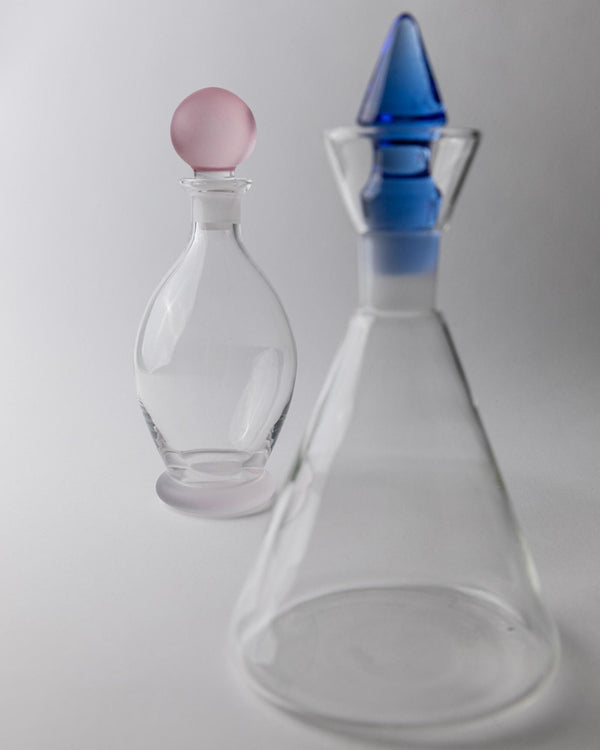 Vintage 1980s Glass Decanter Set of 2, Clear Glass with pink, blue Stoppers, Different Sculptural Shapes, Bar Accessory, Elegant Gift Idea_Bottega Jacobs